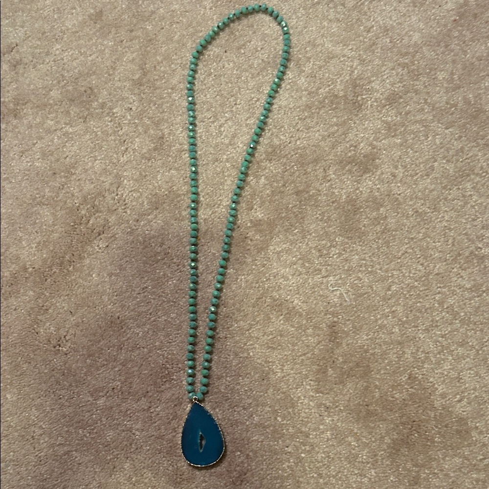 Elegant Green Beaded Necklace with Blue Pendant